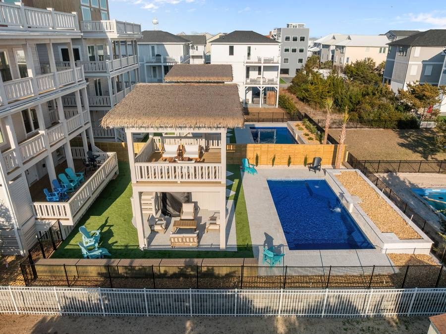 Backyard pool and covered cabana at a coastal North Carolina home
