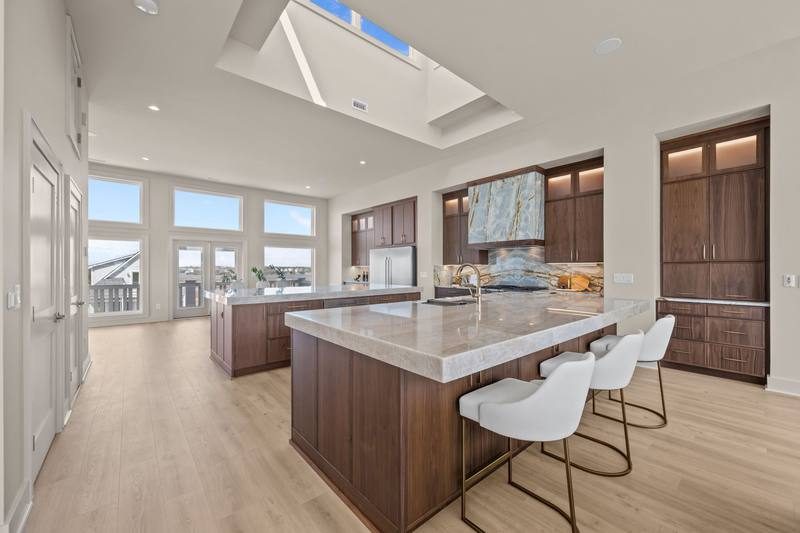 Open kitchen with large island and natural light