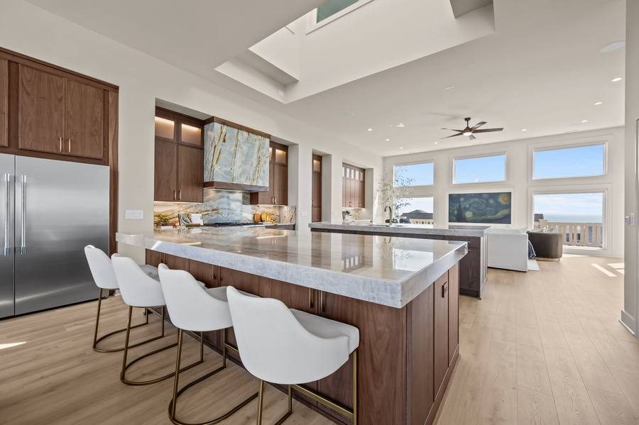 Open living and dining space with coastal views